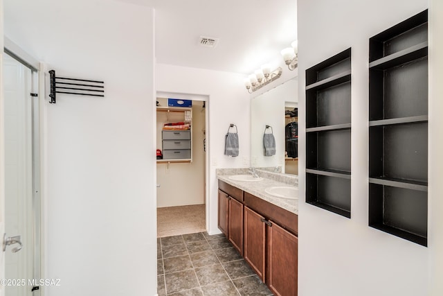 8045 S Red Sox Rd, Tucson, AZ 85756 - full bathroom with double vanity and a walk in closet