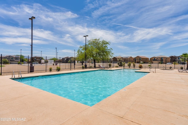 8045 S Red Sox Rd, Tucson, AZ 85756 - community pool featuring fence, a residential view, and a patio area