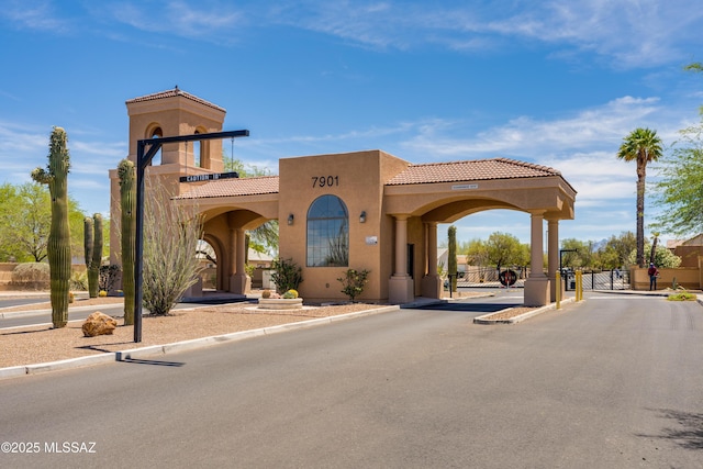 8045 S Red Sox Rd, Tucson, AZ 85756 - view of front of property with a gate, stucco siding, and a tile roof