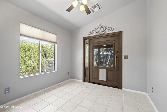 8807 S Desert Rainbow Dr, Tucson, AZ 85747 - tiled foyer featuring plenty of natural light, a ceiling fan, baseboards, and lofted ceiling