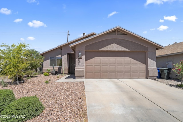 8807 S Desert Rainbow Dr, Tucson, AZ 85747 - single story home with stucco siding, concrete driveway, and an attached garage