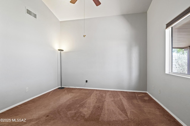 8807 S Desert Rainbow Dr, Tucson, AZ 85747 - unfurnished room featuring carpet flooring, ceiling fan, baseboards, and vaulted ceiling