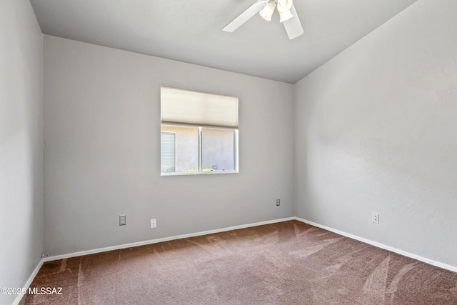 8807 S Desert Rainbow Dr, Tucson, AZ 85747 - spare room with carpet, ceiling fan, and baseboards