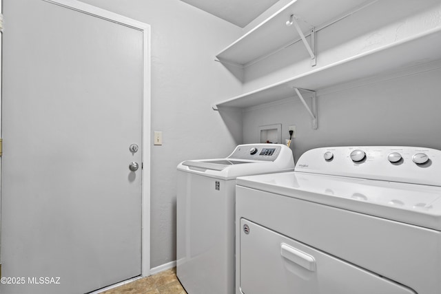 8807 S Desert Rainbow Dr, Tucson, AZ 85747 - washroom with independent washer and dryer and baseboards