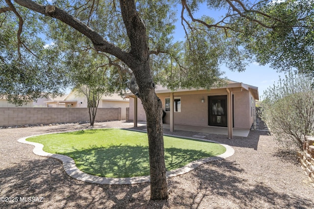 8807 S Desert Rainbow Dr, Tucson, AZ 85747 - rear view of property with stucco siding and a patio