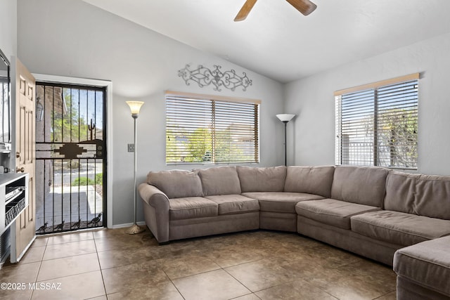 8807 S Desert Rainbow Dr, Tucson, AZ 85747 - living room featuring lofted ceiling, healthy amount of natural light, ceiling fan, and light tile patterned floors