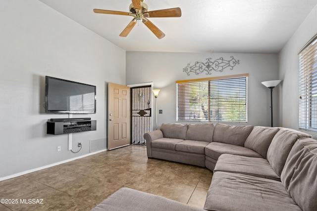 8807 S Desert Rainbow Dr, Tucson, AZ 85747 - tiled living room with lofted ceiling, a ceiling fan, and baseboards