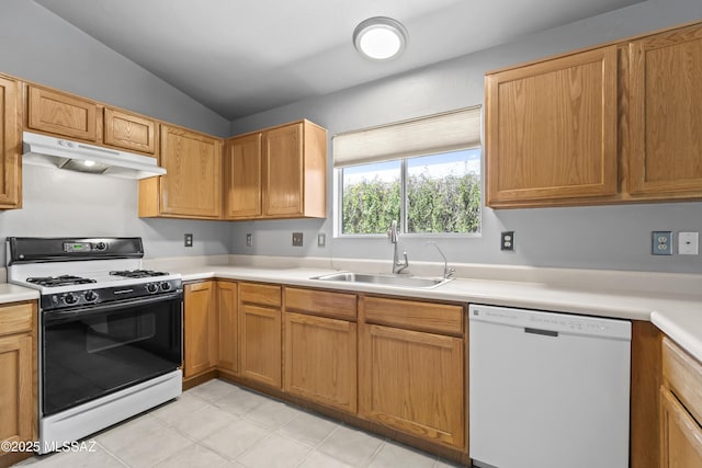 8807 S Desert Rainbow Dr, Tucson, AZ 85747 - kitchen featuring white appliances, under cabinet range hood, a sink, light countertops, and vaulted ceiling