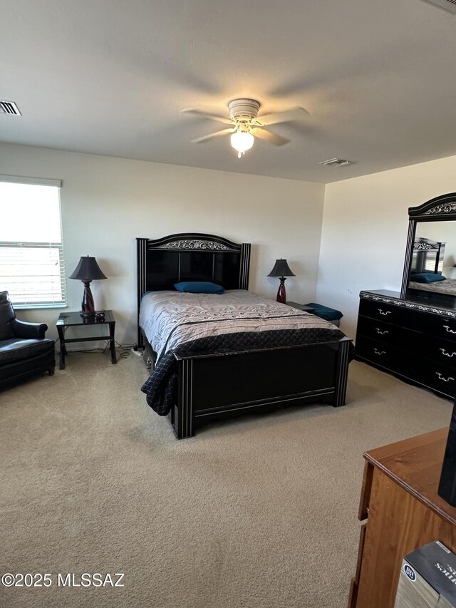 1027 E Madera Grove Ln, Sahuarita, AZ 85629 - bedroom with light colored carpet and ceiling fan