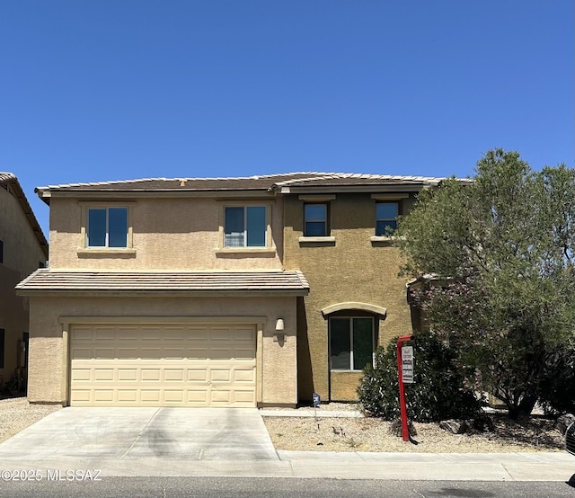 1027 E Madera Grove Ln, Sahuarita, AZ 85629 - view of front of property with stucco siding, concrete driveway, and an attached garage