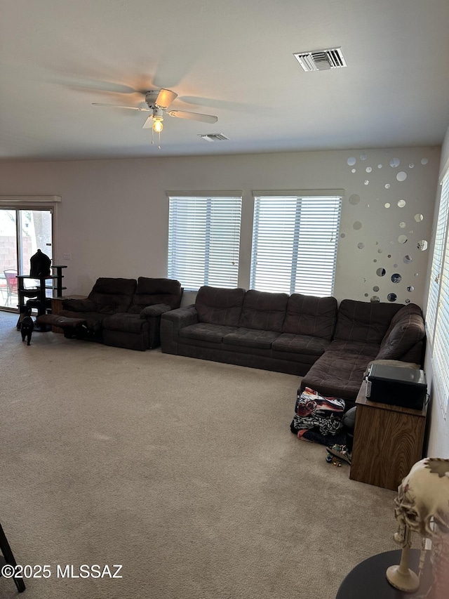 1027 E Madera Grove Ln, Sahuarita, AZ 85629 - carpeted living area with a ceiling fan