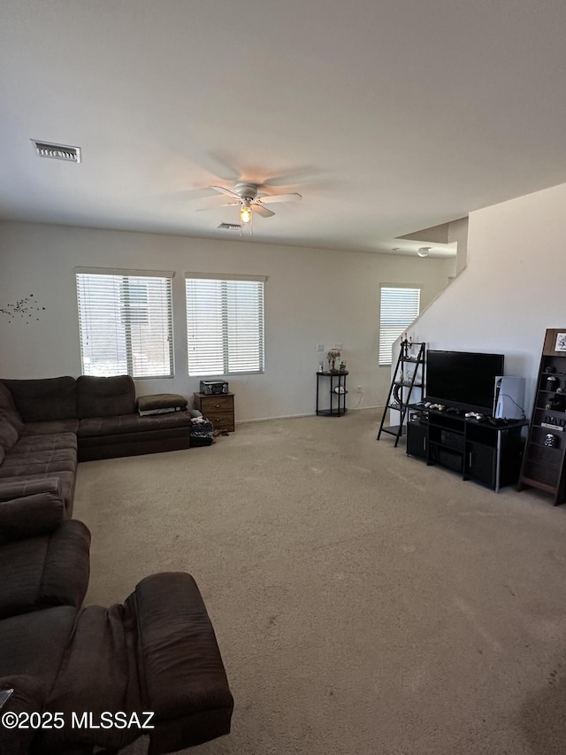 1027 E Madera Grove Ln, Sahuarita, AZ 85629 - carpeted living room featuring ceiling fan and plenty of natural light