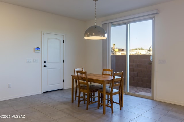 1126 E Cairn St, Tucson, AZ 85719 - dining space featuring light tile patterned flooring and baseboards
