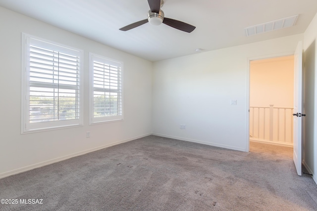 1126 E Cairn St, Tucson, AZ 85719 - carpeted spare room featuring a ceiling fan and baseboards