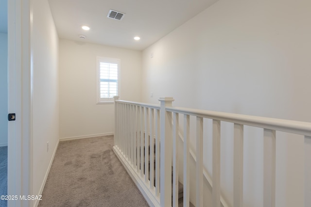 1126 E Cairn St, Tucson, AZ 85719 - hallway with light carpet, recessed lighting, and baseboards