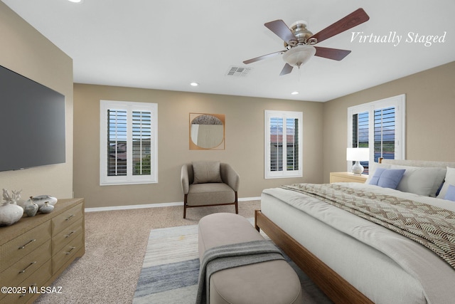 carpeted bedroom featuring baseboards, recessed lighting, and ceiling fan