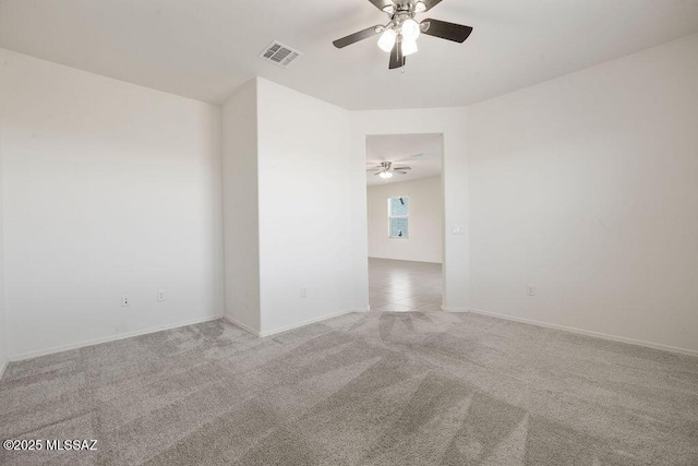 14259 E Yellow Sage Ln, Vail, AZ 85641 - empty room featuring ceiling fan, light colored carpet, and baseboards