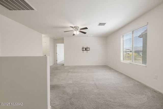 14259 E Yellow Sage Ln, Vail, AZ 85641 - spare room featuring a ceiling fan and light colored carpet