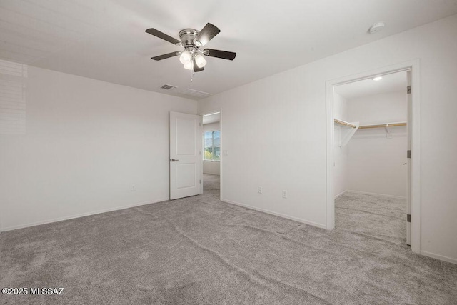 14259 E Yellow Sage Ln, Vail, AZ 85641 - unfurnished bedroom featuring carpet floors, a ceiling fan, baseboards, and a spacious closet