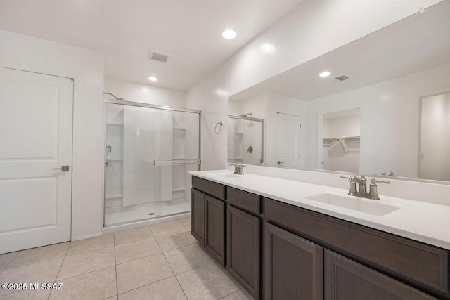 14259 E Yellow Sage Ln, Vail, AZ 85641 - bathroom with a shower stall, double vanity, tile patterned floors, and recessed lighting