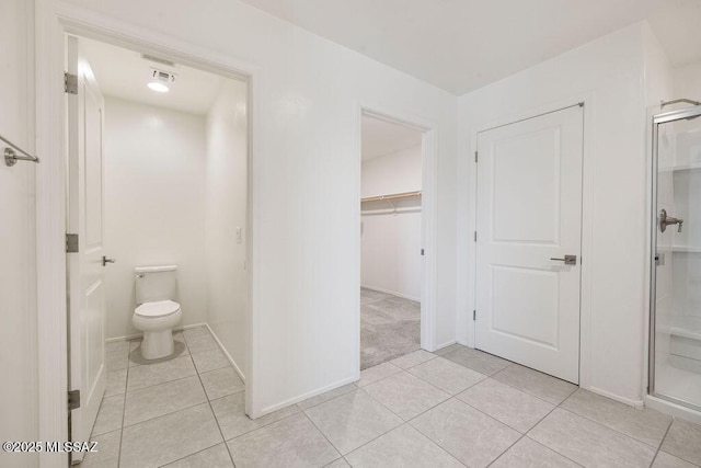 14259 E Yellow Sage Ln, Vail, AZ 85641 - full bathroom with tile patterned flooring, toilet, baseboards, and an enclosed shower