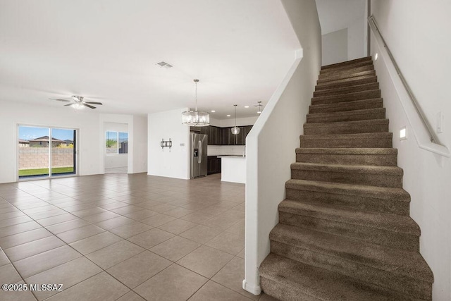 14259 E Yellow Sage Ln, Vail, AZ 85641 - staircase with tile patterned floors, a chandelier, a ceiling fan, and recessed lighting