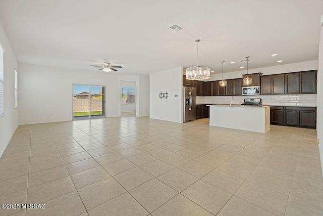 14259 E Yellow Sage Ln, Vail, AZ 85641 - unfurnished living room featuring a chandelier, light tile patterned flooring, a ceiling fan, recessed lighting, and a sink