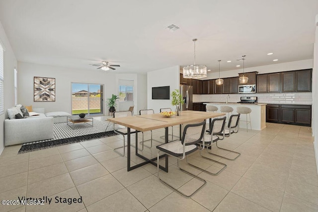 14259 E Yellow Sage Ln, Vail, AZ 85641 - dining area with light tile patterned flooring, a chandelier, ceiling fan, and recessed lighting