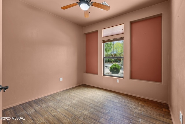 110 Post Way, Tubac, AZ 85646 - empty room featuring wood finished floors, ceiling fan, and baseboards