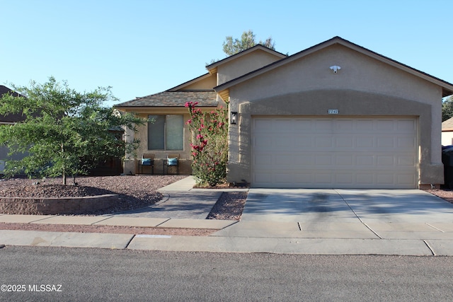 7747 S Lions Spring Way, Tucson, AZ 85747 - single story home featuring stucco siding, concrete driveway, and an attached garage