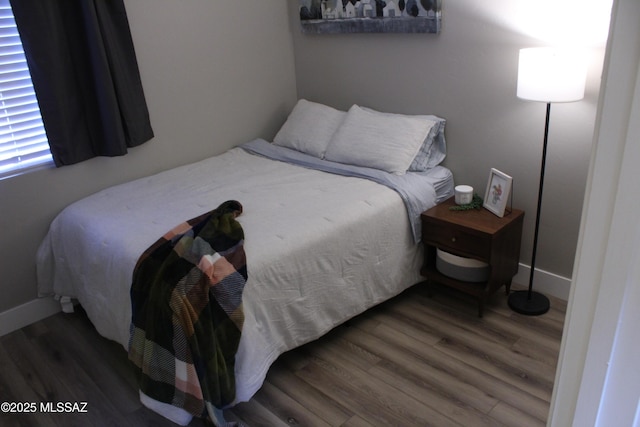 7747 S Lions Spring Way, Tucson, AZ 85747 - bedroom featuring wood finished floors and baseboards