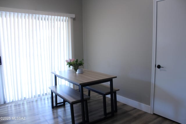 7747 S Lions Spring Way, Tucson, AZ 85747 - dining space featuring dark wood-type flooring and baseboards