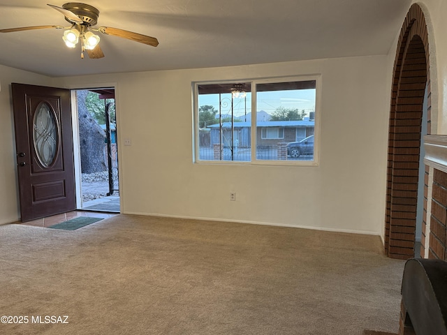 4910 N Gold Ave, Tucson, AZ 85705 - carpeted entryway with baseboards and a ceiling fan