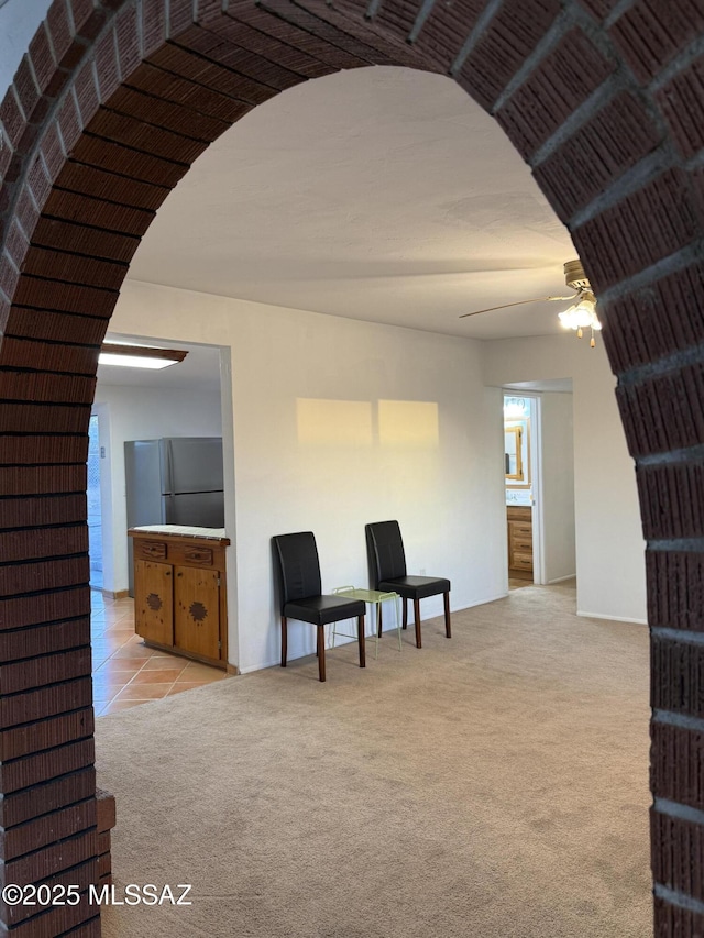 4910 N Gold Ave, Tucson, AZ 85705 - living area featuring a ceiling fan and light carpet