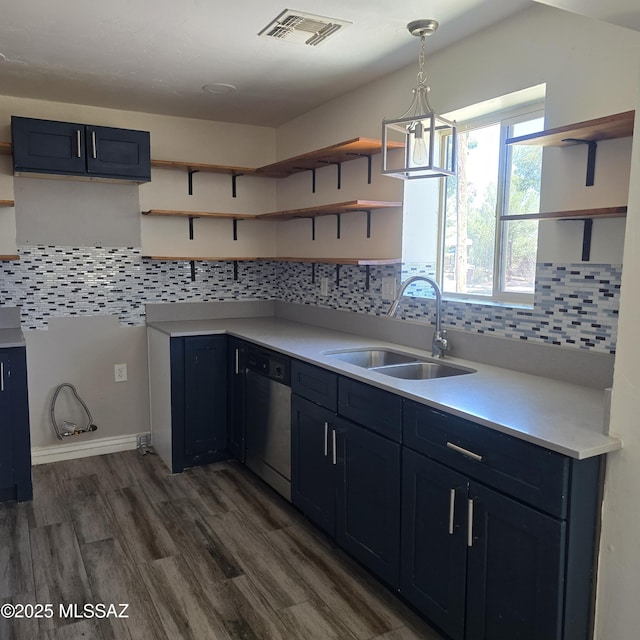 5850 E Lee St, Tucson, AZ 85712 - kitchen with open shelves, a sink, stainless steel dishwasher, dark wood finished floors, and light countertops