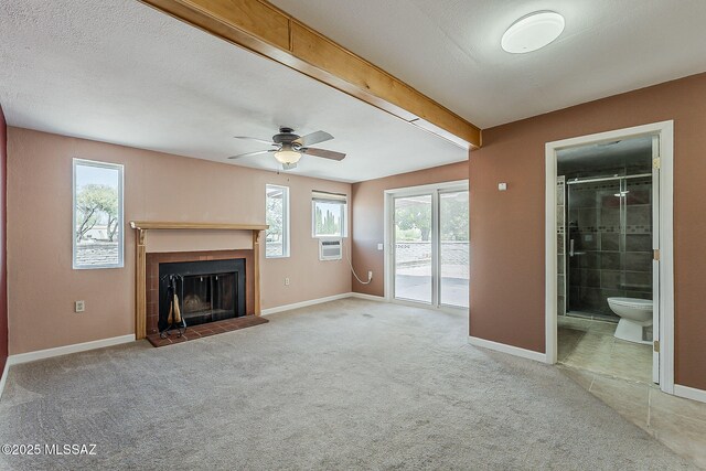 140 W Calle Melendrez, Green Valley, AZ 85614 - unfurnished living room featuring a tile fireplace, healthy amount of natural light, carpet floors, and ceiling fan