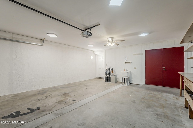140 W Calle Melendrez, Green Valley, AZ 85614 - garage featuring a garage door opener and a textured wall