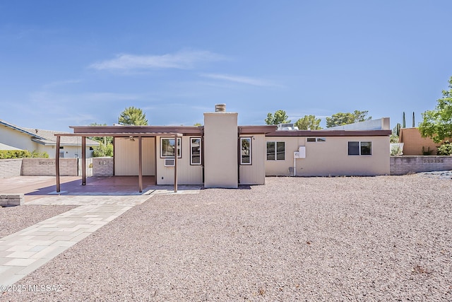 140 W Calle Melendrez, Green Valley, AZ 85614 - back of property with a patio area, a chimney, and a ceiling fan