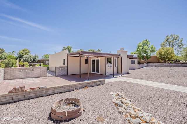 140 W Calle Melendrez, Green Valley, AZ 85614 - rear view of property featuring a patio area, an outdoor fire pit, and a fenced backyard