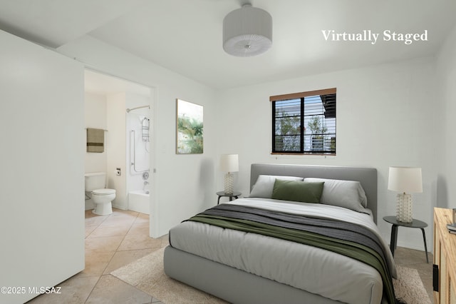 135 S Paseo Quinta Unit D, Green Valley, AZ 85614 - bedroom featuring light tile patterned floors and ensuite bathroom