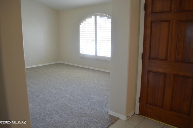 1645 E Ganymede Dr, Tucson, AZ 85737 - entryway featuring light colored carpet and baseboards