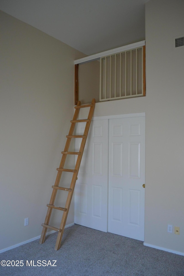 1645 E Ganymede Dr, Tucson, AZ 85737 - unfurnished bedroom featuring carpet floors, baseboards, and a closet