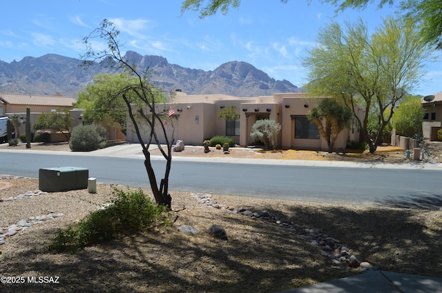 1645 E Ganymede Dr, Tucson, AZ 85737 - view of front facade with a mountain view and stucco siding