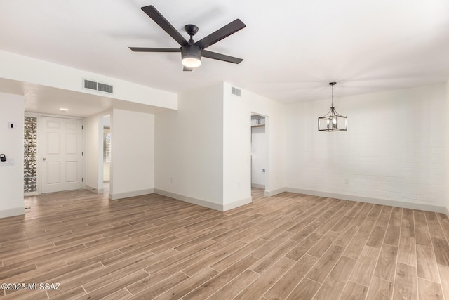 1200 S Alpine Cir, Green Valley, AZ 85614 - unfurnished living room with light wood-type flooring, baseboards, and a ceiling fan