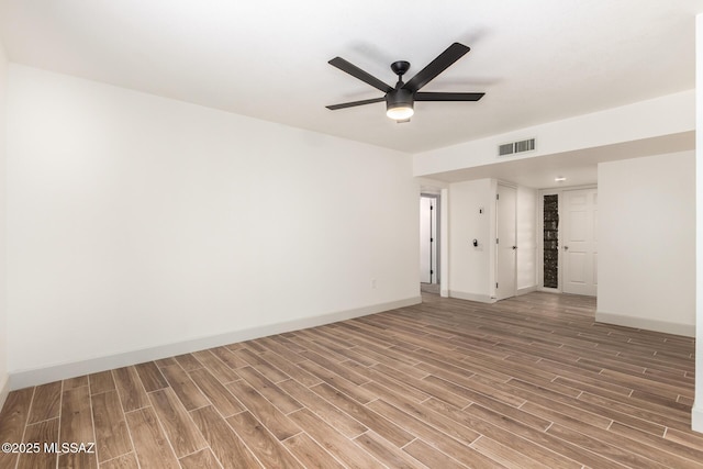 1200 S Alpine Cir, Green Valley, AZ 85614 - unfurnished room with light wood finished floors, baseboards, and a ceiling fan