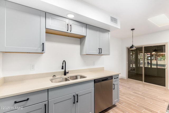 1200 S Alpine Cir, Green Valley, AZ 85614 - kitchen featuring stainless steel dishwasher, a sink, gray cabinets, and light countertops