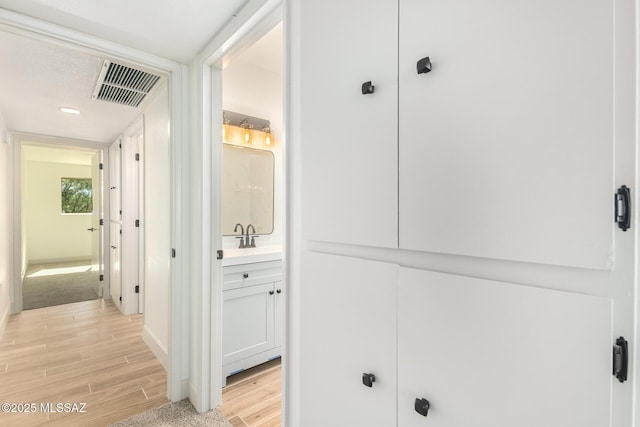 1200 S Alpine Cir, Green Valley, AZ 85614 - corridor with light wood-style floors