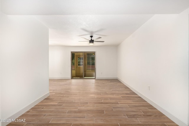 1200 S Alpine Cir, Green Valley, AZ 85614 - spare room with ceiling fan, light wood-style floors, and baseboards
