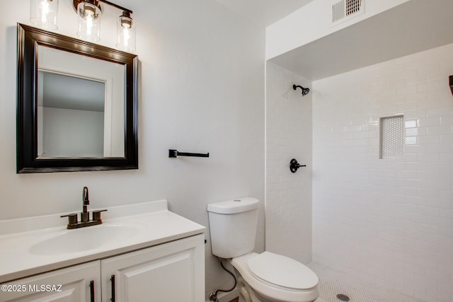 9570 E Sellarole Rd, Tucson, AZ 85730 - full bathroom featuring vanity, toilet, and tiled shower