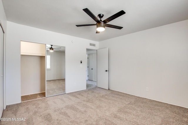 9570 E Sellarole Rd, Tucson, AZ 85730 - unfurnished bedroom featuring light colored carpet, a closet, and a ceiling fan